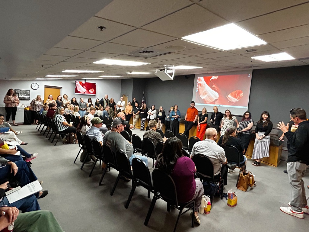 New employees gather in a meeting room during Aztec Municipal Schools' New Employee Orientation as district leaders welcome them to the 2026–2027 school year.