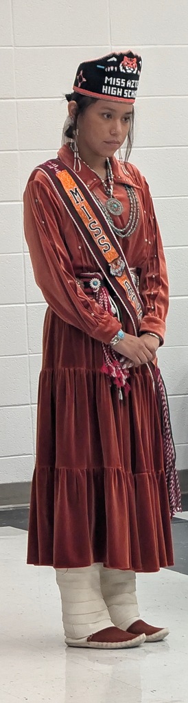 Photos from the annual Miss and Mr. Aztec High School Pageant. Students showcase traditional Navajo clothing, cultural regalia, and pageant sashes. The photos include a Miss Aztec High School titleholder, a student speaking into a microphone, a student holding traditional wooden sticks, and two pageant participants posing with bouquets of flowers.