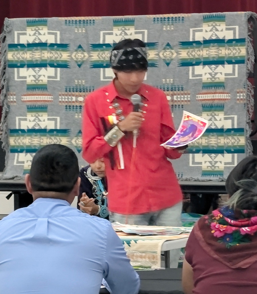 Photos from the annual Miss and Mr. Aztec High School Pageant. Students showcase traditional Navajo clothing, cultural regalia, and pageant sashes. The photos include a Miss Aztec High School titleholder, a student speaking into a microphone, a student holding traditional wooden sticks, and two pageant participants posing with bouquets of flowers.