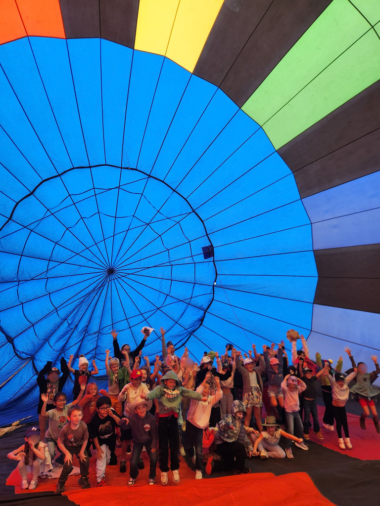 Lydia Rippey students learn about hot air balloons and get the chance to explore a real, colorful hot air balloon with the help of Jaidan Martinez and Tylee Torrez from Pagosa Adventures.