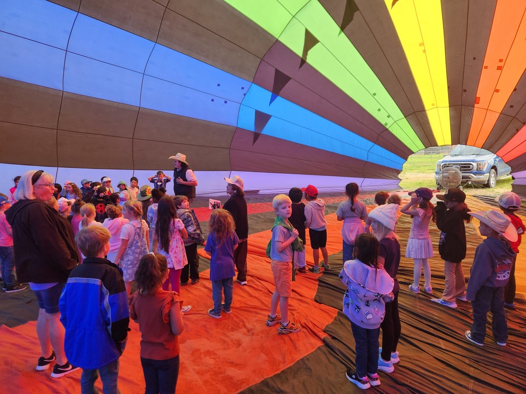 Lydia Rippey students learn about hot air balloons and get the chance to explore a real, colorful hot air balloon with the help of Jaidan Martinez and Tylee Torrez from Pagosa Adventures.