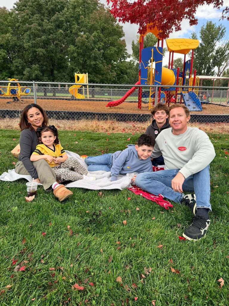McCoy Avenue Elementary kindergarten students and their families enjoy a picnic together on the playground during Friday’s Kindergarten Family Picnic.