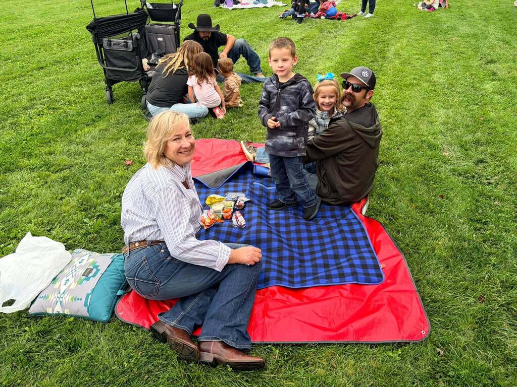 McCoy Avenue Elementary kindergarten students and their families enjoy a picnic together on the playground during Friday’s Kindergarten Family Picnic.