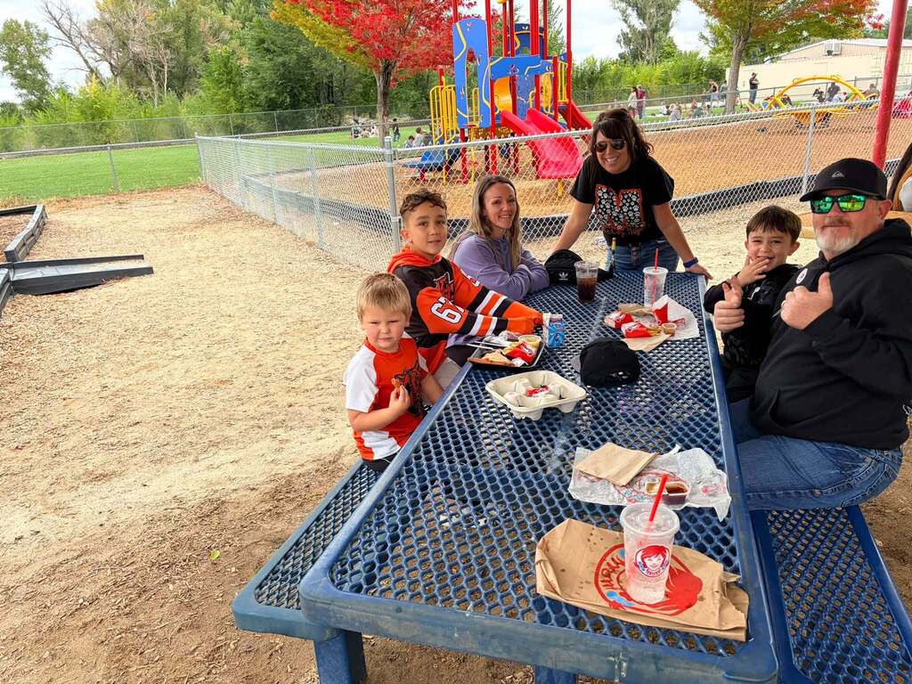 McCoy Avenue Elementary kindergarten students and their families enjoy a picnic together on the playground during Friday’s Kindergarten Family Picnic.