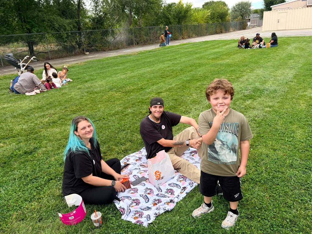 McCoy Avenue Elementary kindergarten students and their families enjoy a picnic together on the playground during Friday’s Kindergarten Family Picnic.