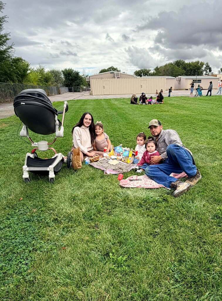 McCoy Avenue Elementary kindergarten students and their families enjoy a picnic together on the playground during Friday’s Kindergarten Family Picnic.