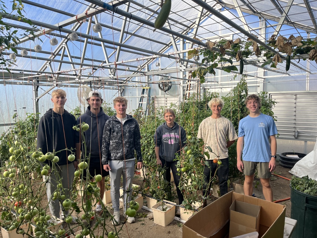 Students work at the community garden