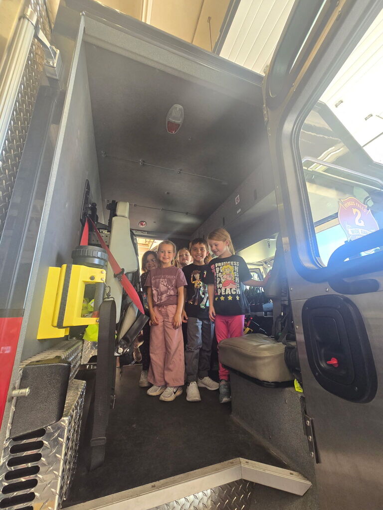 Kindergartners inside fire truck