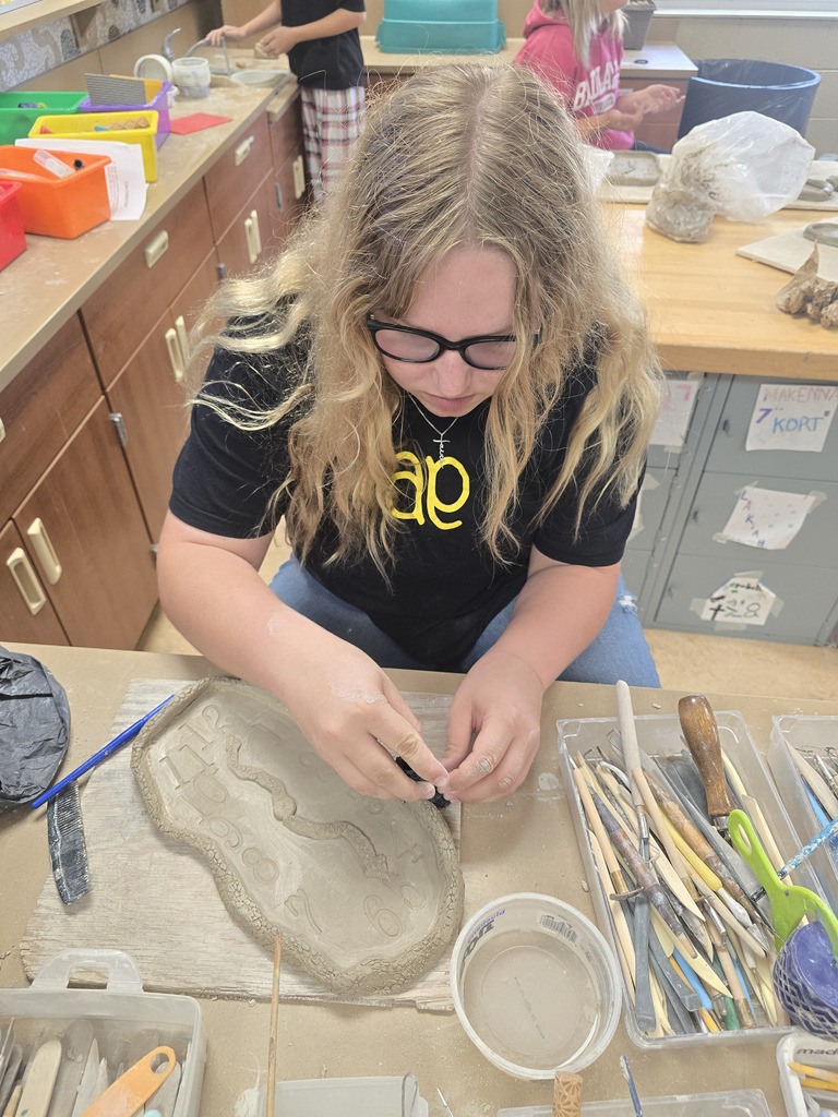 8th grade art students used clay to create their own clocks that appear to be melting