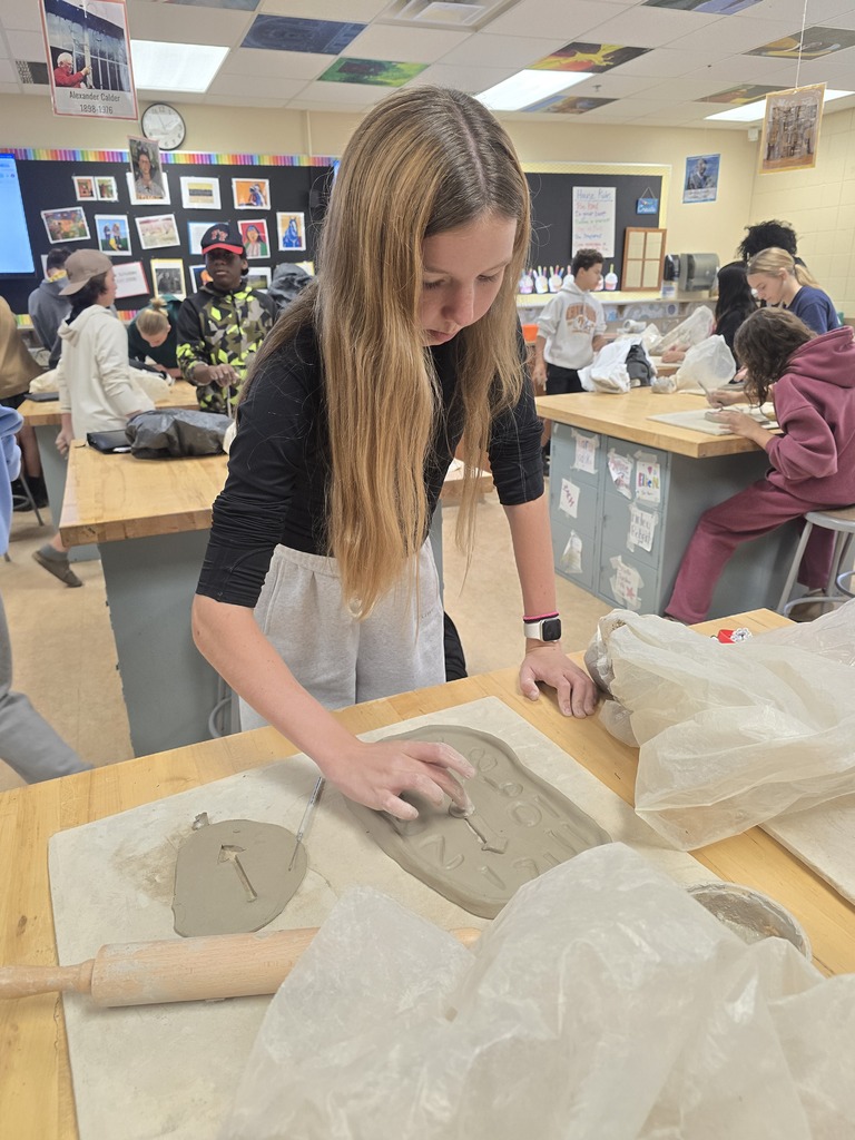 Students make clay clocks in art class