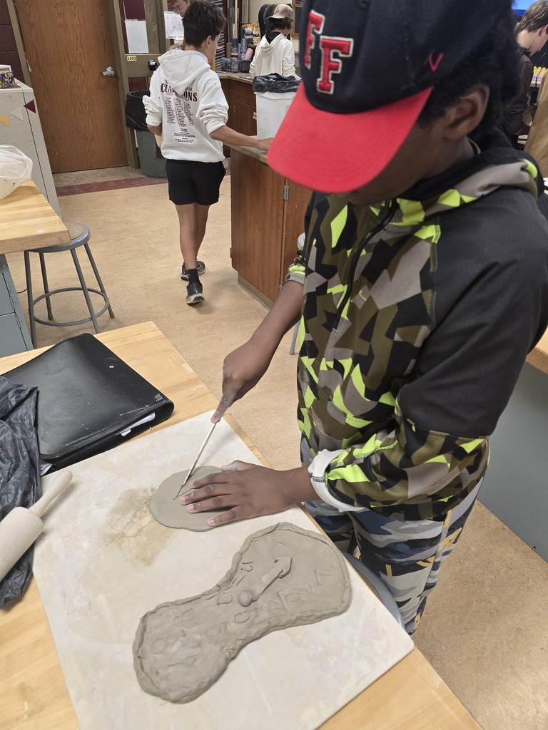 Students make clay clocks in art class