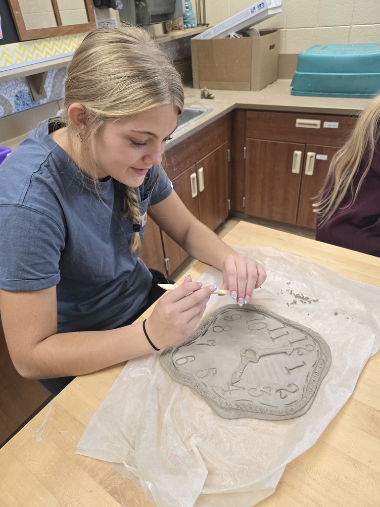 Students make clay clocks in art class