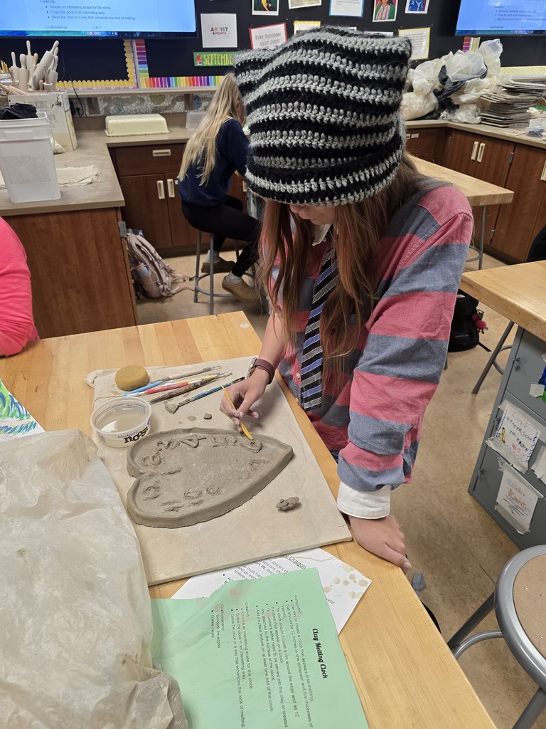 Students make clay clocks in art class
