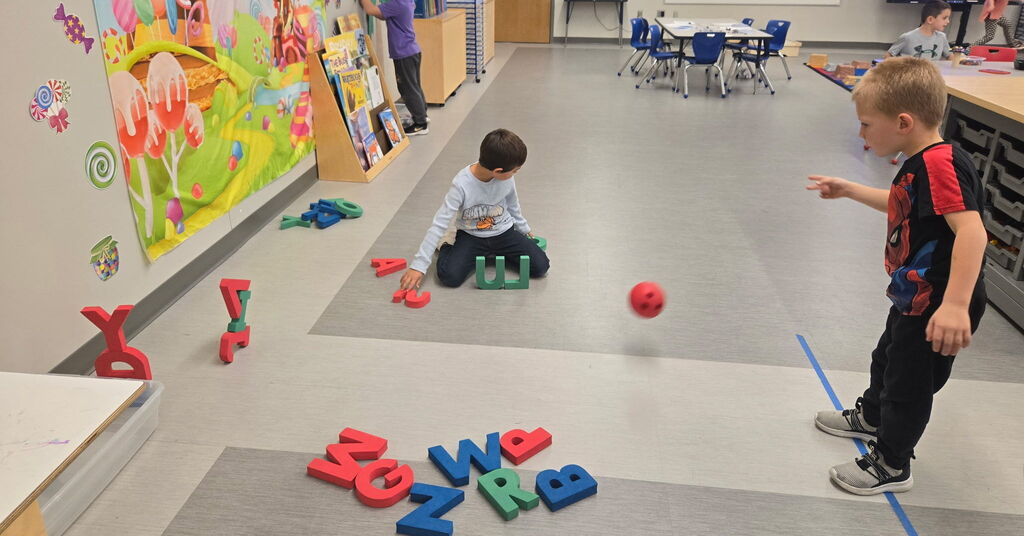 Kindergarteners celebrating letters with Chicka Chicka Boom Boom Day