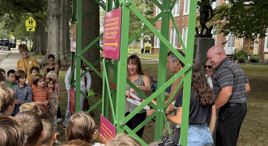Ms. Hurley and artists cut the ribbon!