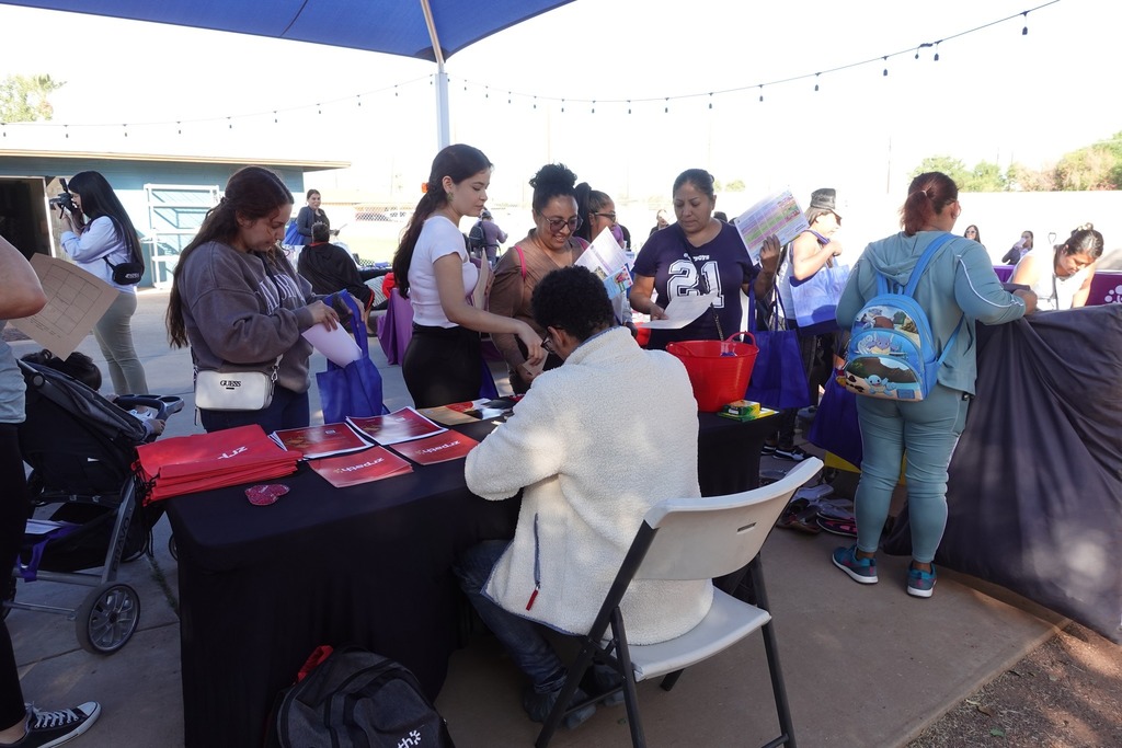 Community members mingling at Heart of Isaac's Resource day event.