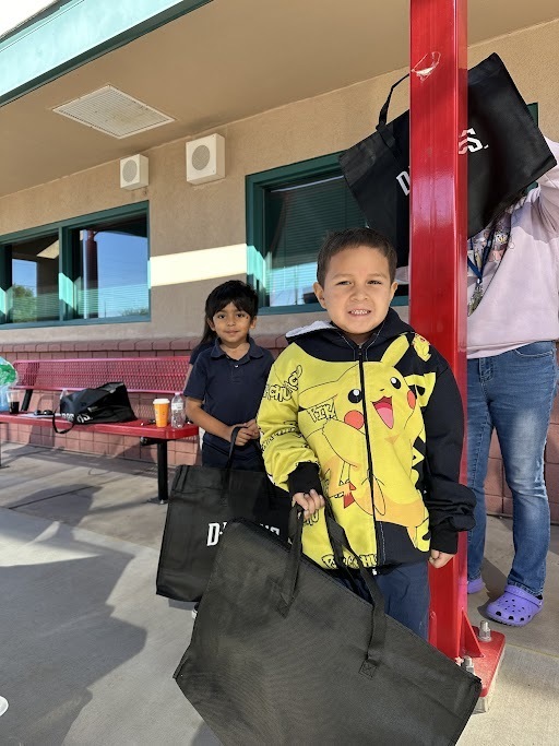 two students excited for operation school bell