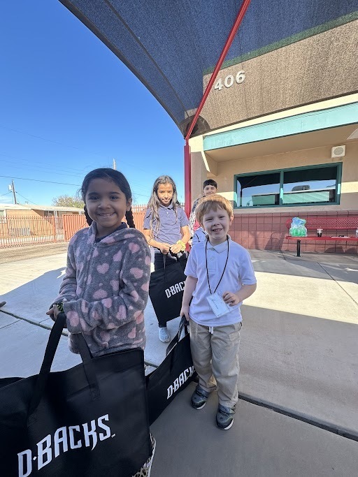 two students waiting to begin their operation school bell event