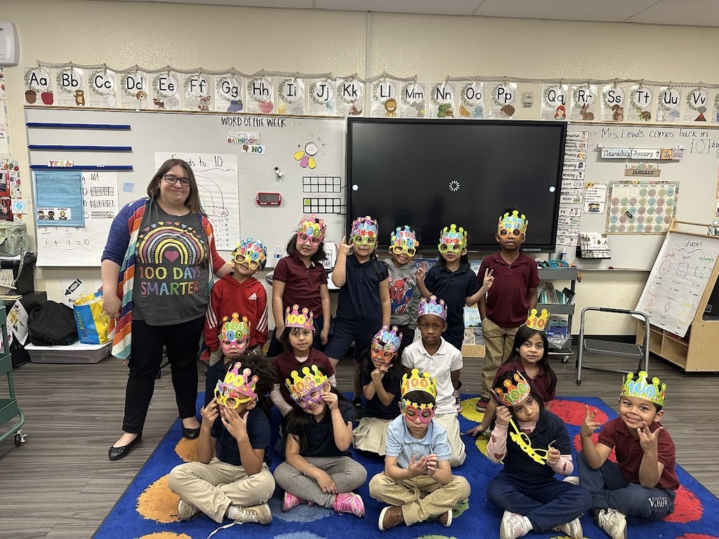 Mrs. lewis and her students on the 100th day of school
