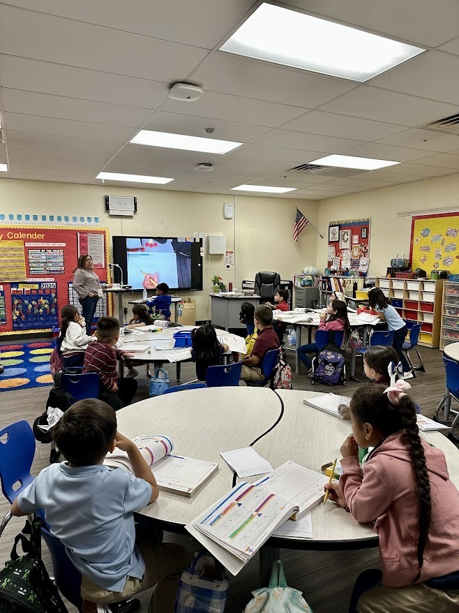 students learning from the teacher in the classroom