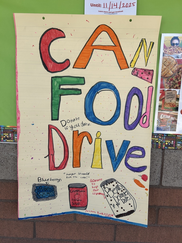 A colorful, vertical, student-made poster on lined yellow paper spelling out "CAN FOOD DRIVE" in large, mixed-color letters. It includes drawings of various canned goods and fruits, with text encouraging people to "Donate if you dare" and "Hunger should kick the can."