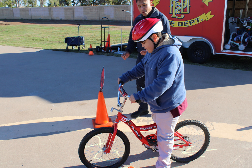 A student riding a bike. 