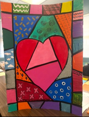 Dedicated to Maria Guzman (Board Member). Features a large pink heart section and green swirl patterns.