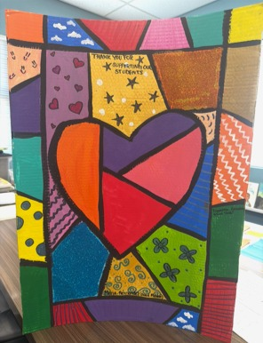 Dedicated to Maria Hernandez (Board Member). Features yellow stars and blue/purple floral patterns.