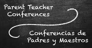 Chalkboard with "Parent Teacher Conferences" written in English and Spanish