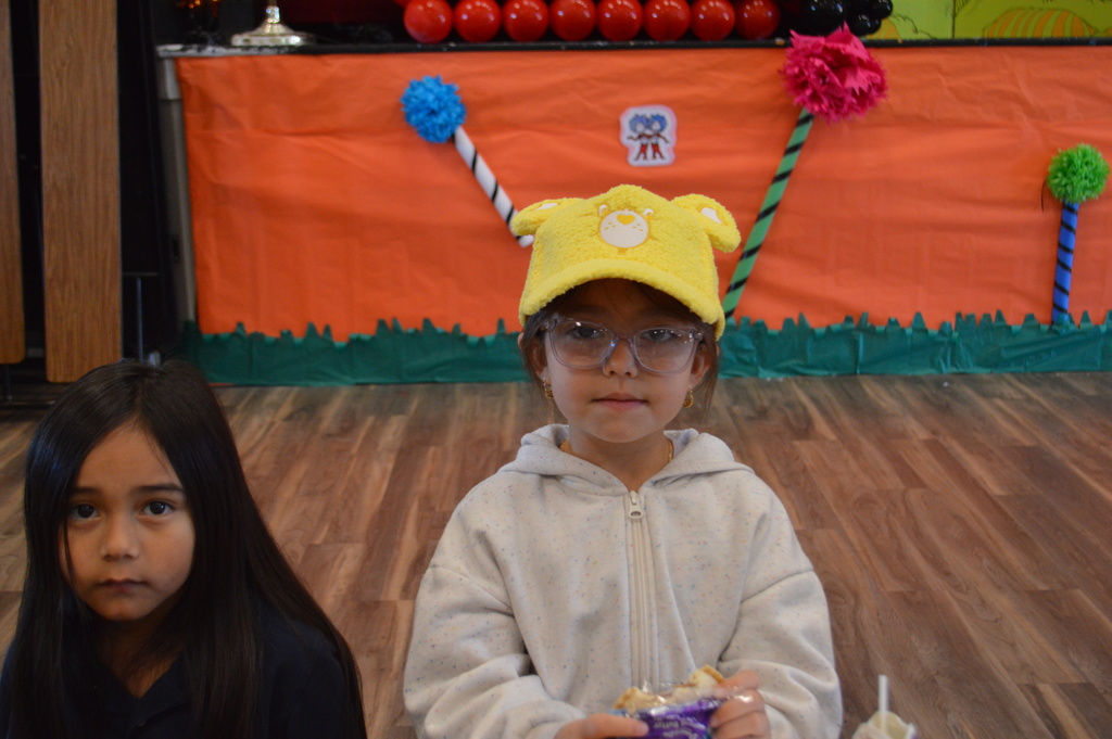 Favorite hat day student in care bear hat 