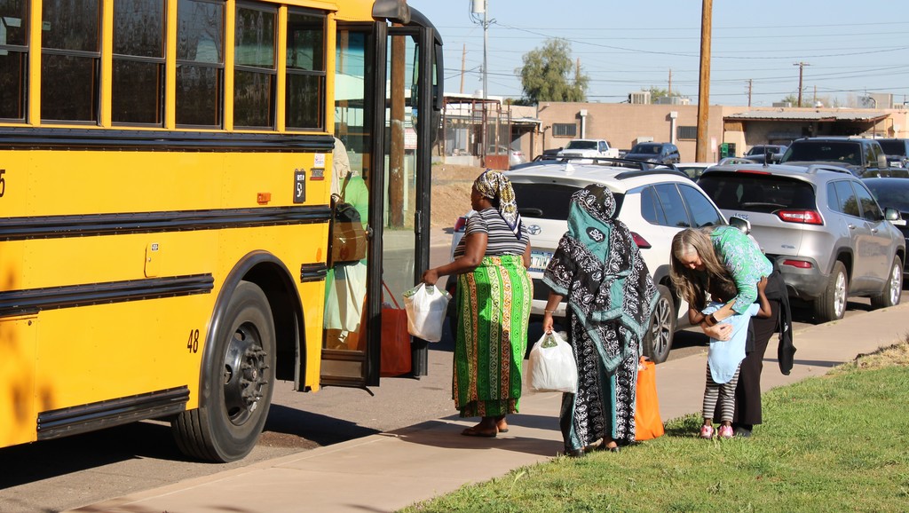 Families Getting on a Bus