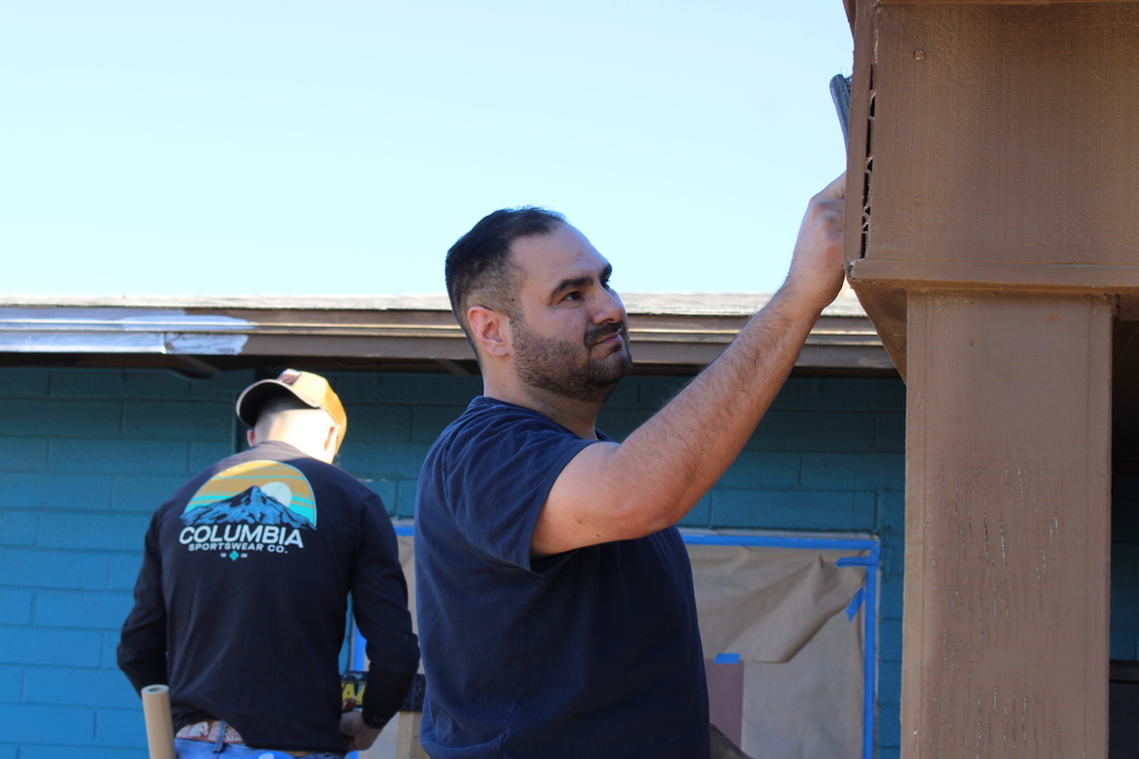 Volunteers painting HOI House
