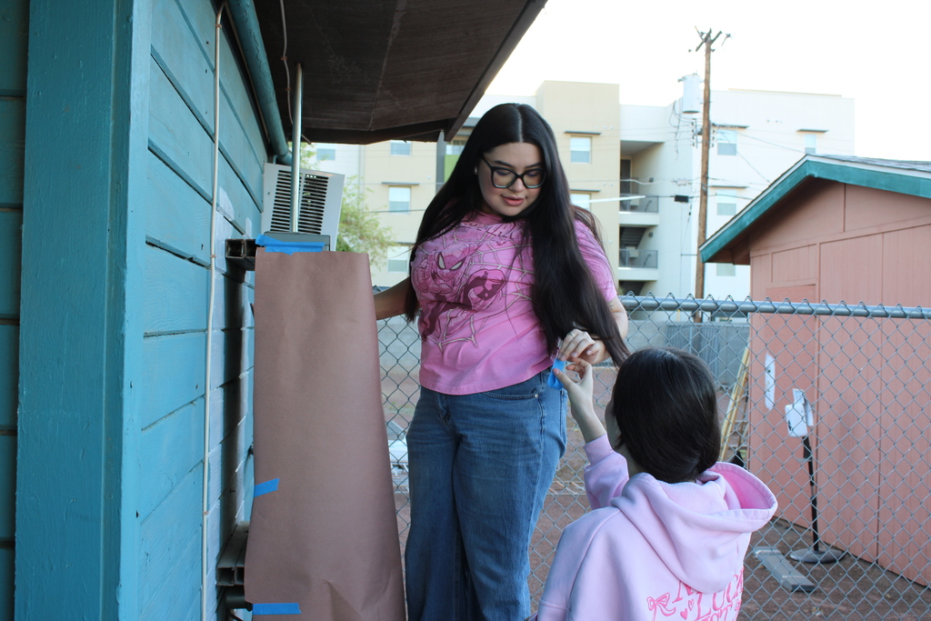 Volunteers painting HOI House