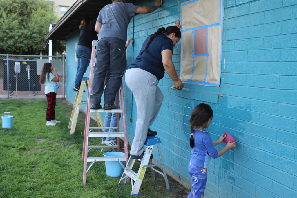 Volunteers painting HOI House