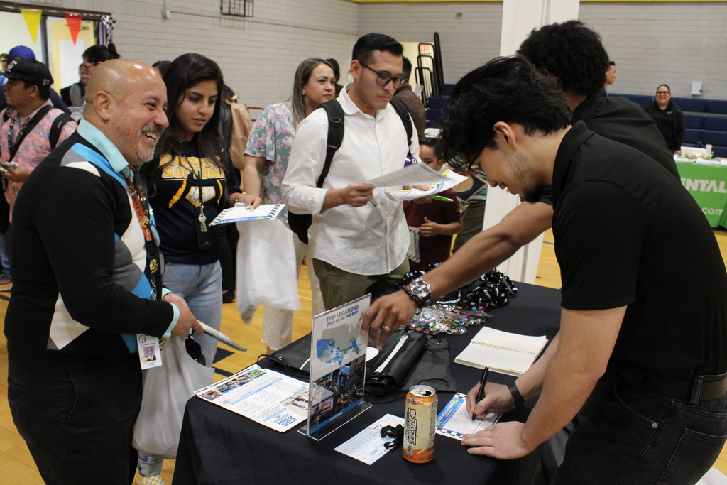 Attendees getting information from a vendor