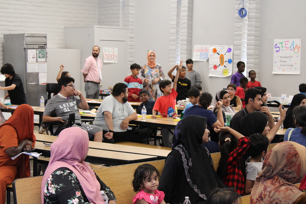 Student raises hand at Joseph Zito Elementary at Title 1 Family Night