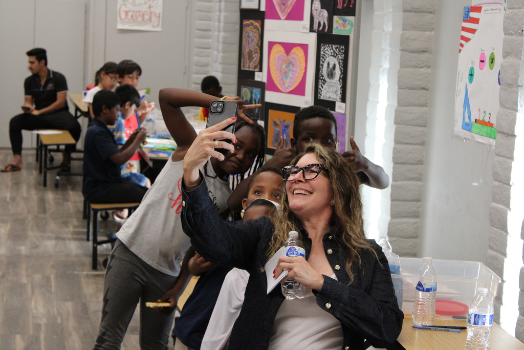Ms. Laura Couret, Principal of Joseph Zito Elementary, taking a selfie with students