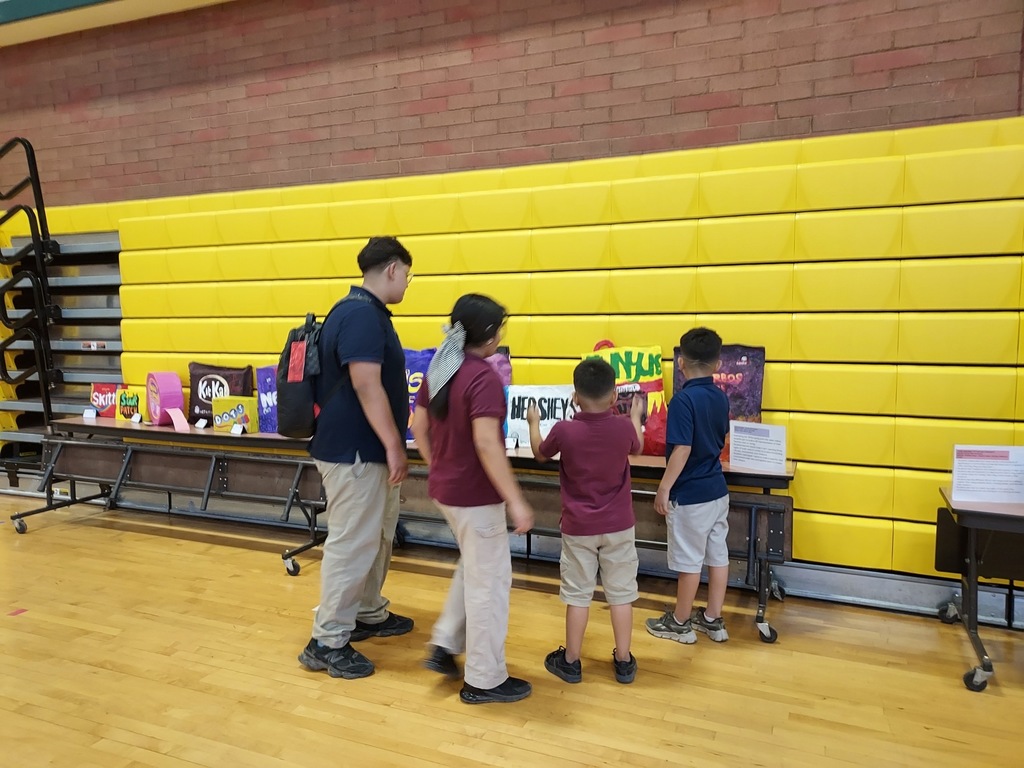 Students viewing art on display