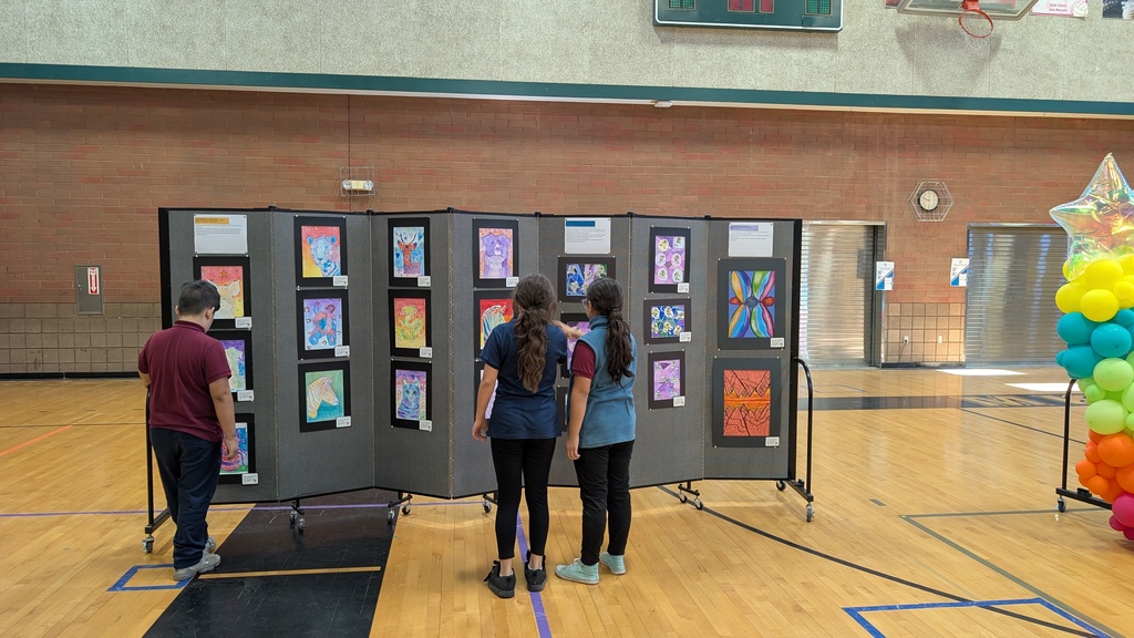 Students viewing art on display