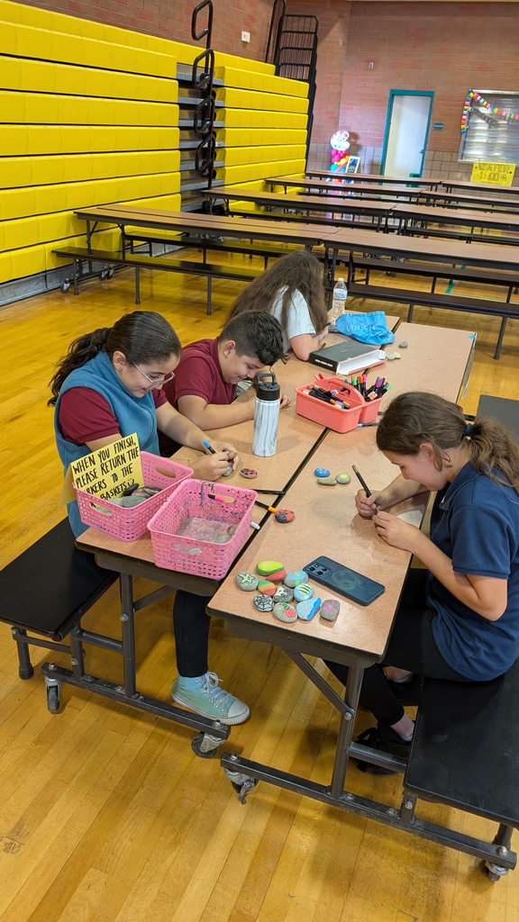 Students painting rocks