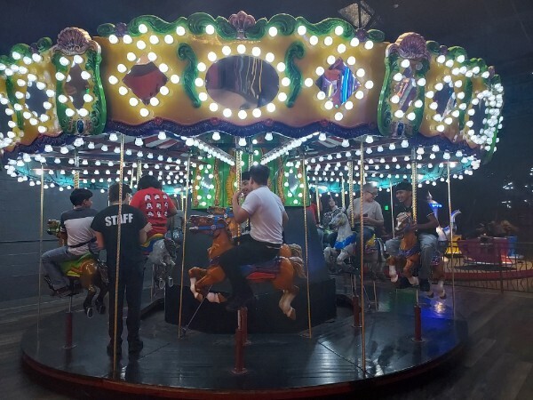 Kids riding a merry-go-round