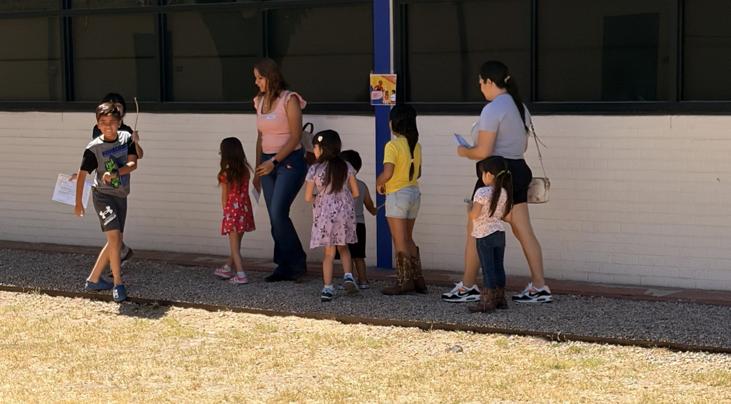 family and students participating in reading challenges at Alta E Butler