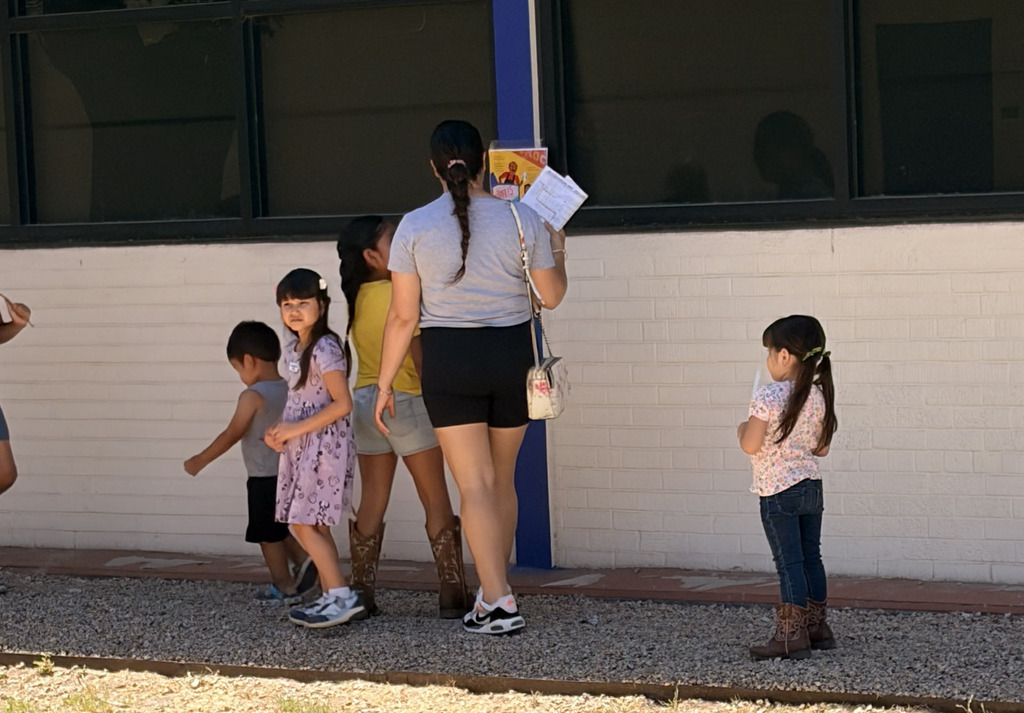 family and students participating in reading challenges at Alta E Butler