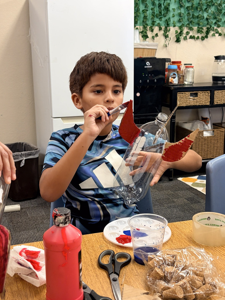 student creating rocket
