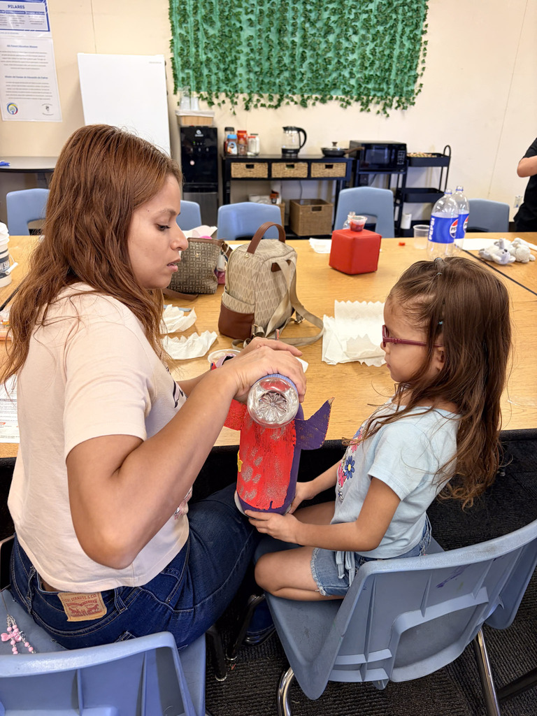Family and student creating rocket