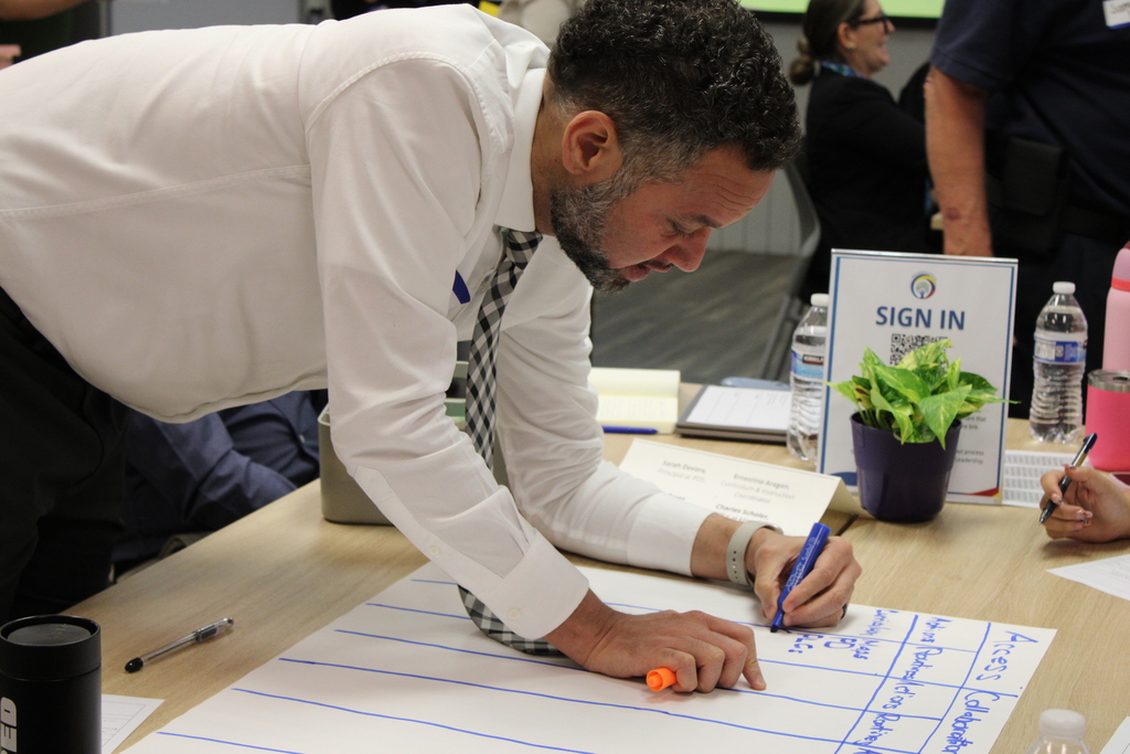 Staff writing down ideas for a leadership exercise