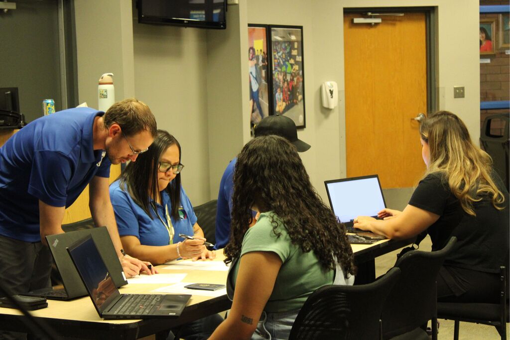 Tech team helping onboard new employees