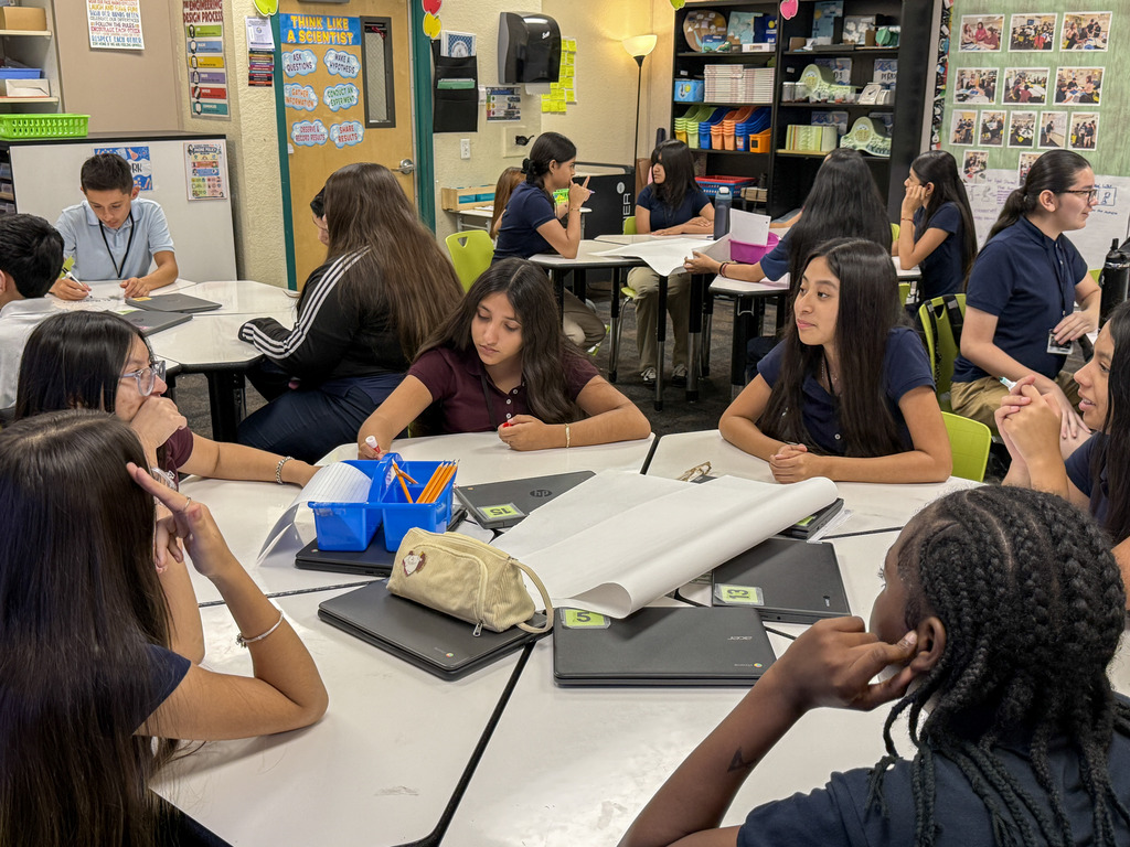 Students in Ms. Magallanes discussing ideas for their invention