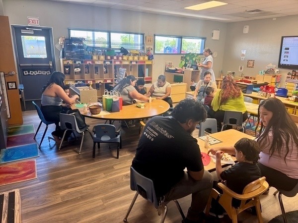 Parents and students doing a project in class
