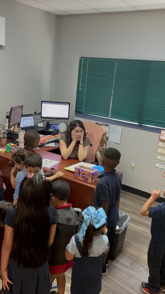 Teacher and kids participating in a scavenger hunt
